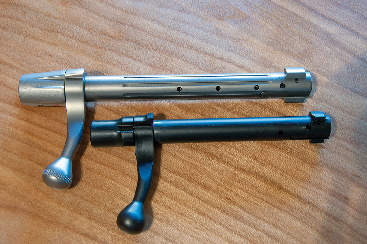 The small diameter MiniAction bolt (bottom) is compared to a Weatherby Vanguard long-action bolt. The difference in size is striking.